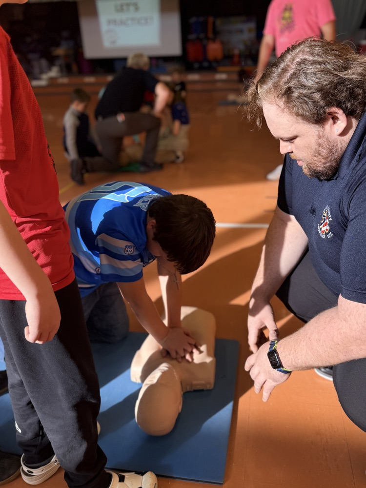 students performing CPR