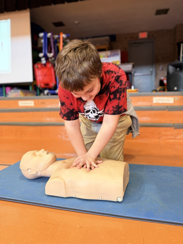 students performing CPR
