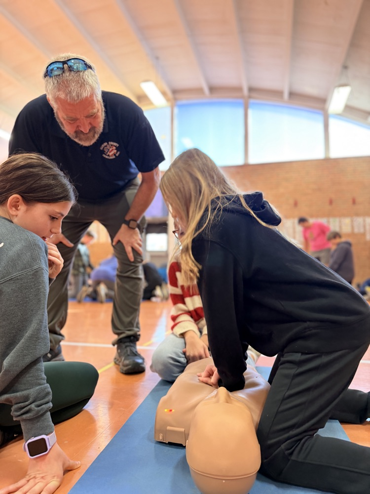 students performing CPR
