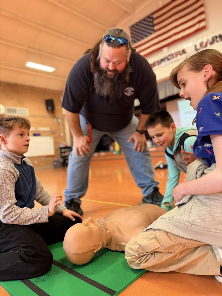 students performing CPR
