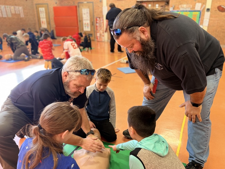 students performing CPR
