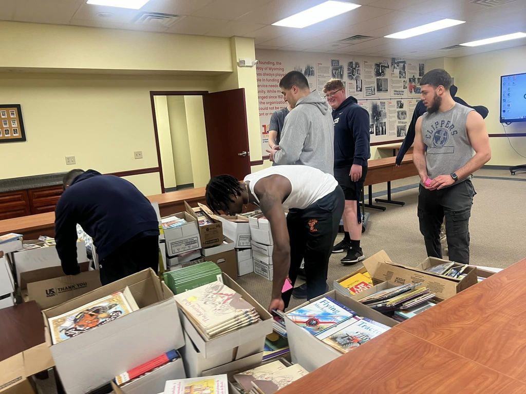 Football players helping with United Way of Wyoming Valley