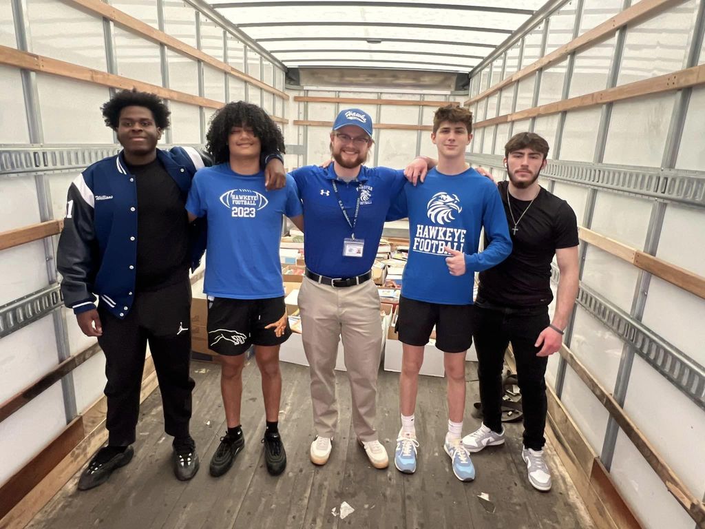 Football players helping with United Way of Wyoming Valley
