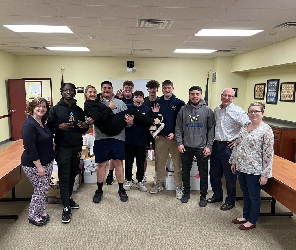 Football players helping with United Way of Wyoming Valley