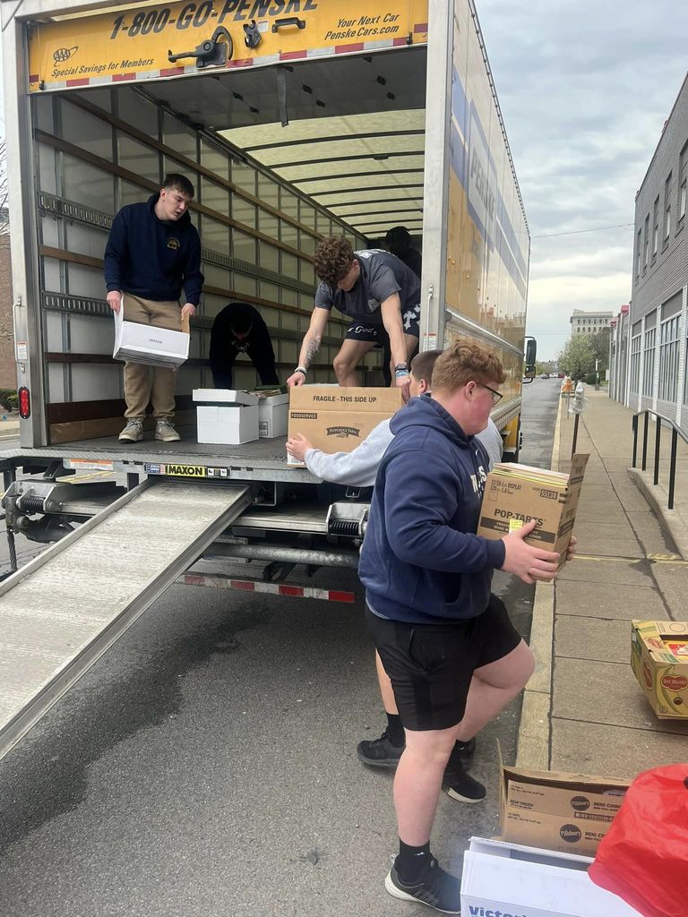Football players helping with United Way of Wyoming Valley