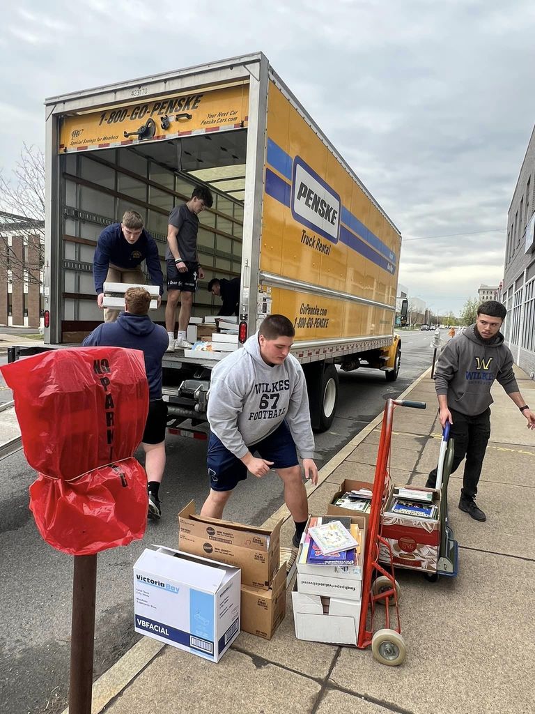 Football players helping with United Way of Wyoming Valley