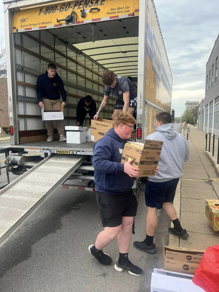 Football players helping with United Way of Wyoming Valley