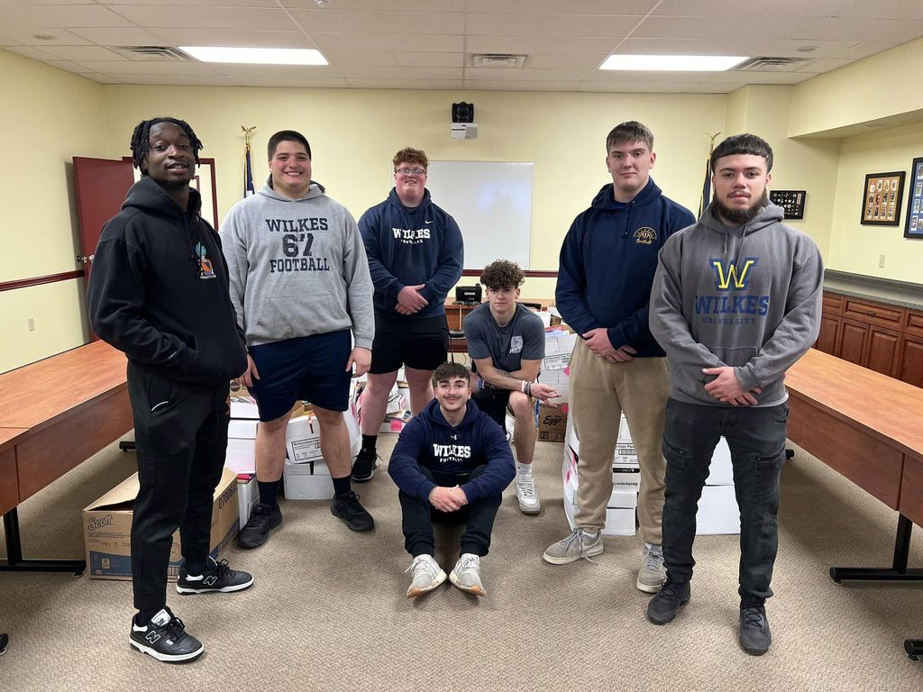 Football players helping with United Way of Wyoming Valley
