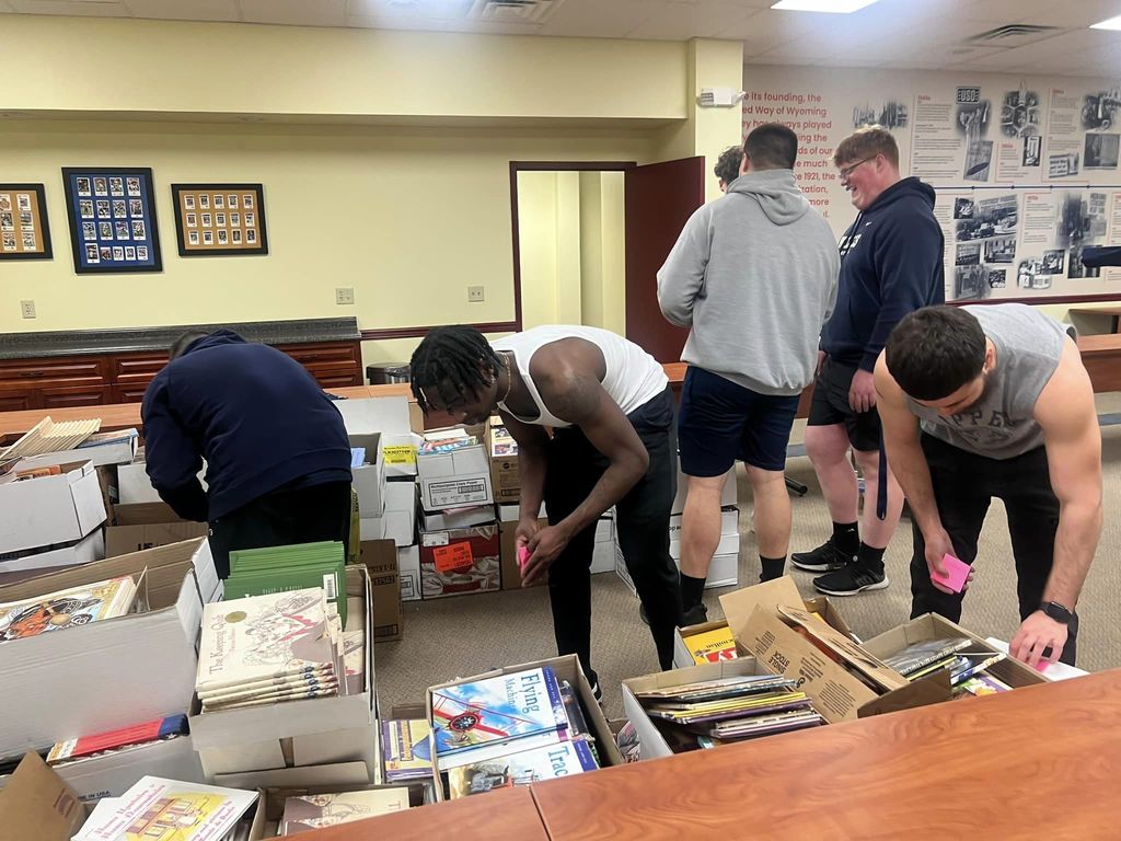 Football players helping with United Way of Wyoming Valley