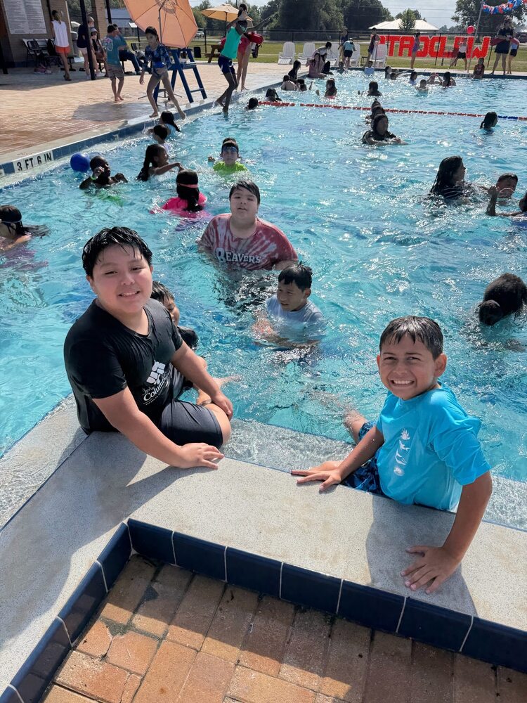 students in the swimming ppool