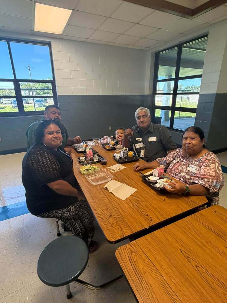 a family eats lunch together