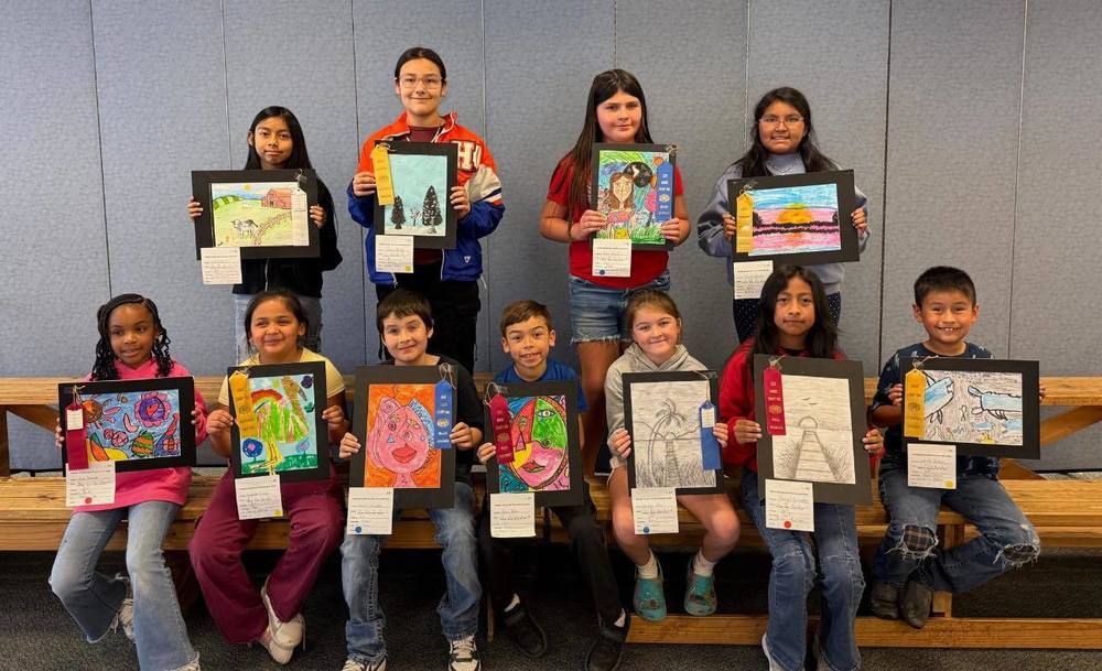 children with their artwork