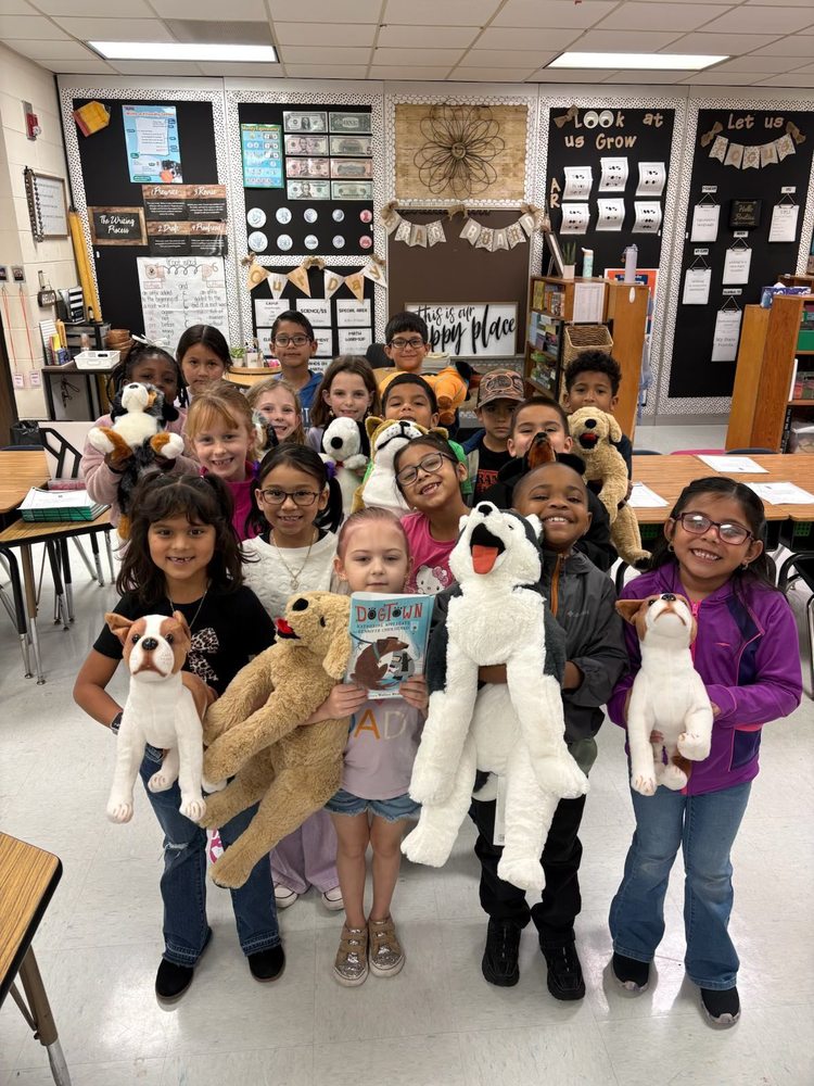Students with their books Dogtown and their dog stuffed animals