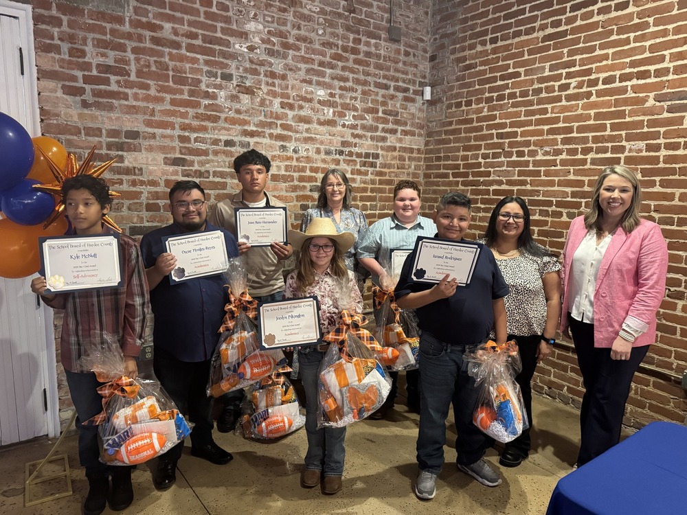 students holding certificates