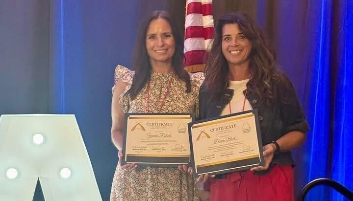 Mrs. Roberts receiving a FASA award