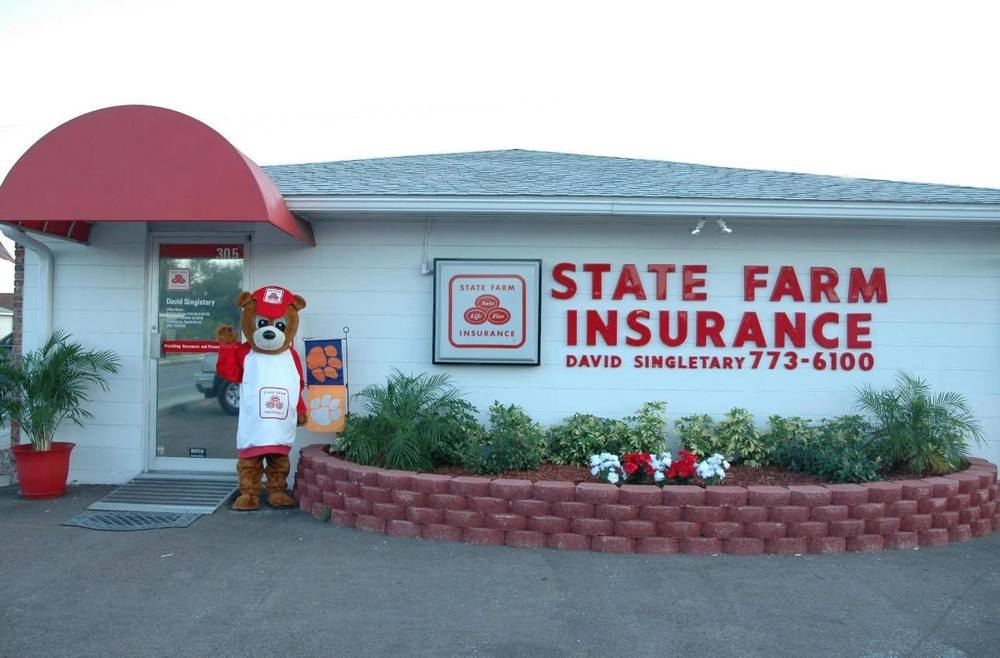 State Farm insurance building with  a person out front dressed as a teddy bear