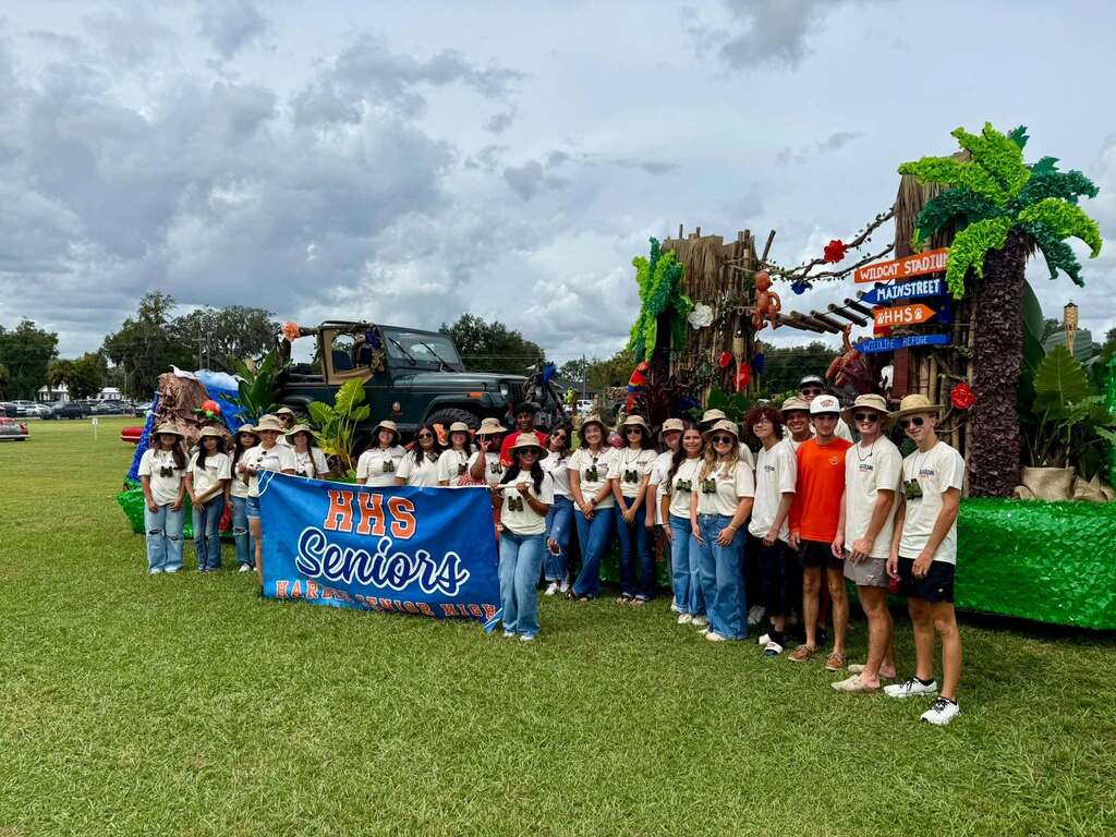 high school seniors in front of their homecoming parade float