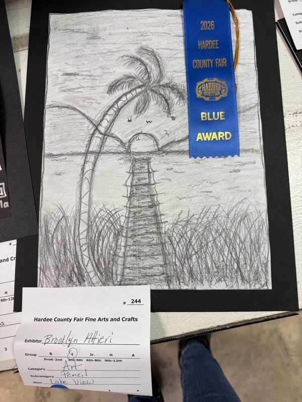child's drawing of a pier with a sunset background won a ribbon at the fair