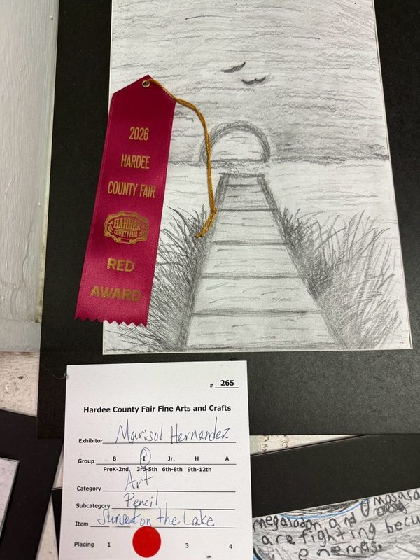 child's drawing of a pier with a sunset background won a ribbon at the fair