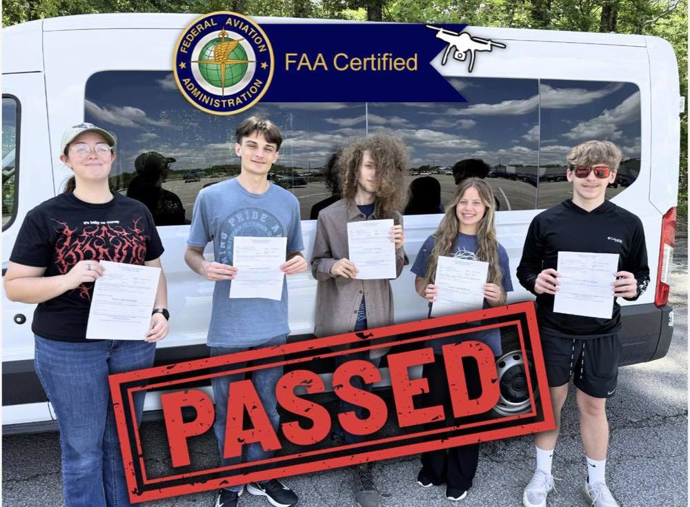 5 Students holding their FAA Drone Pilot Certification