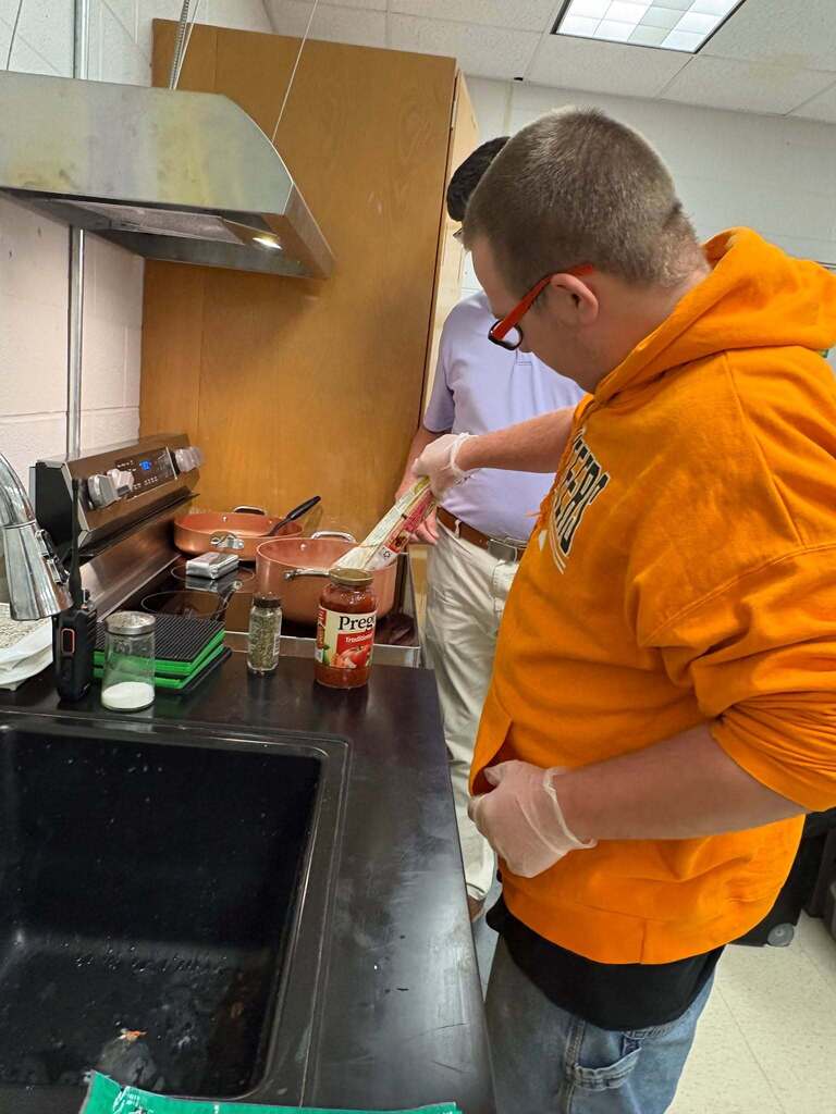 Principal Wilkerson sharing his favorite recipe with Courtesy Inc