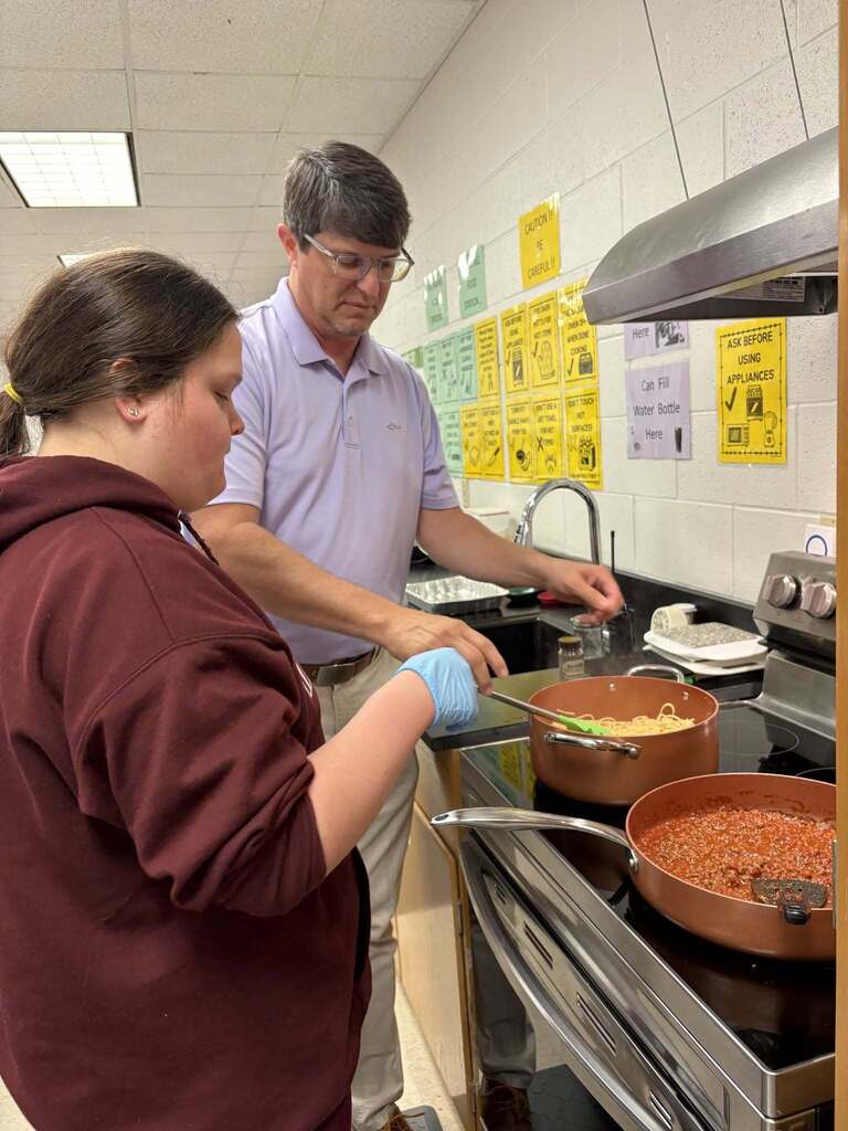 Principal Wilkerson sharing his favorite recipe with Courtesy Inc