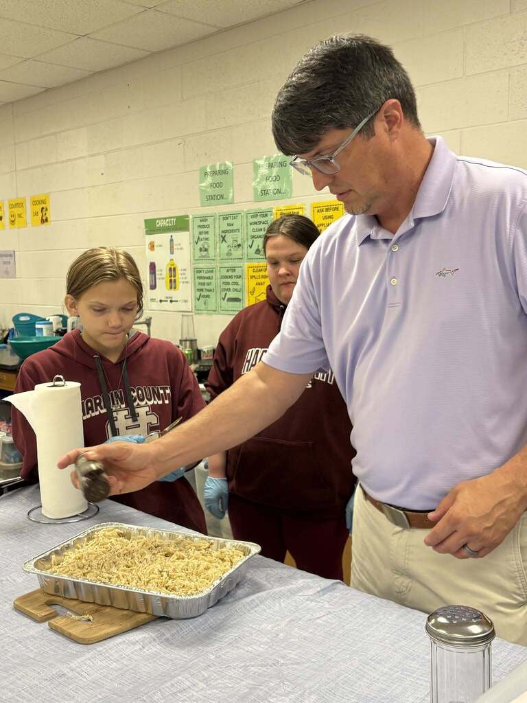 Principal Wilkerson sharing his favorite recipe with Courtesy Inc