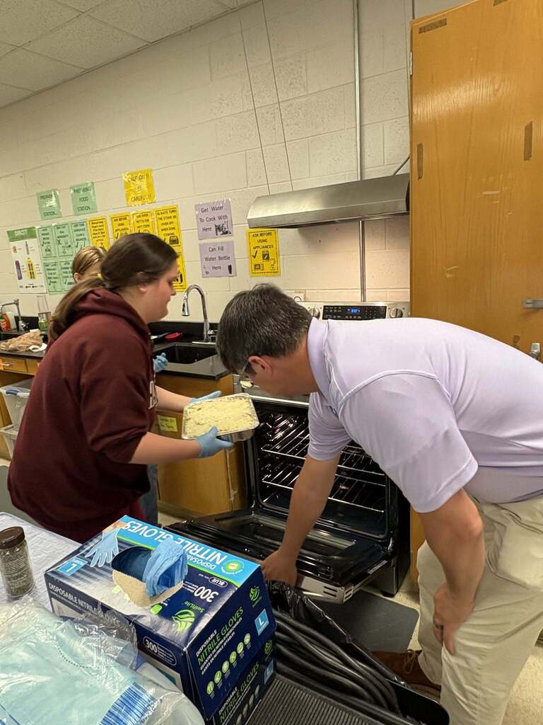 Principal Wilkerson sharing his favorite recipe with Courtesy Inc