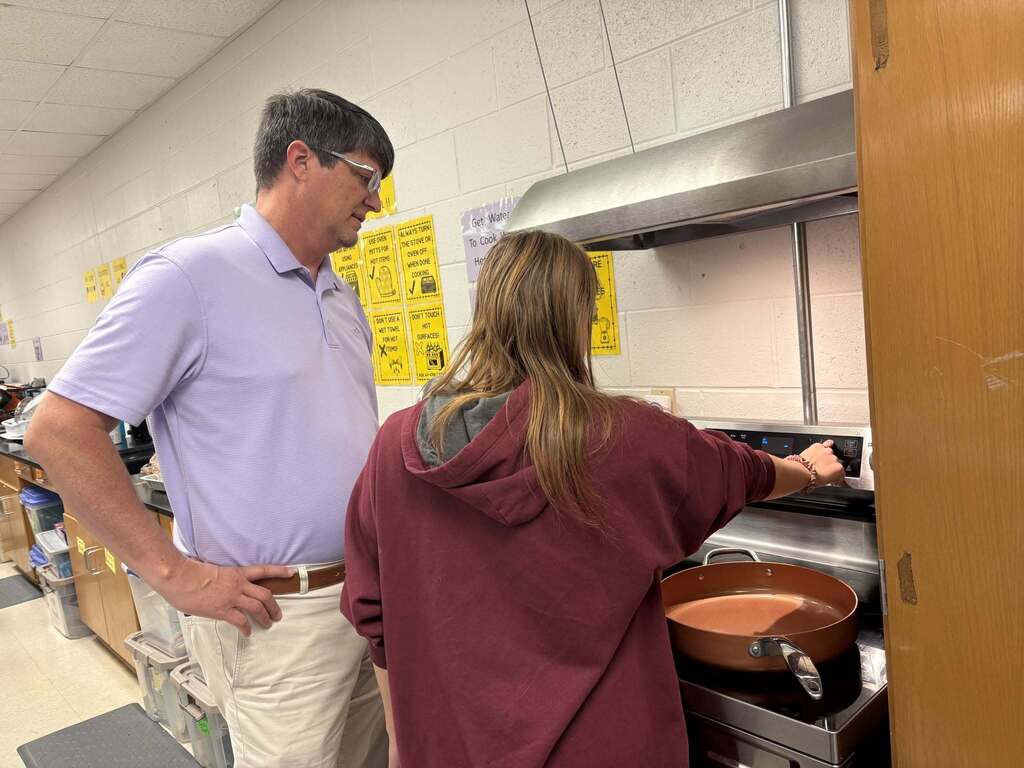 Principal Wilkerson sharing his favorite recipe with Courtesy Inc