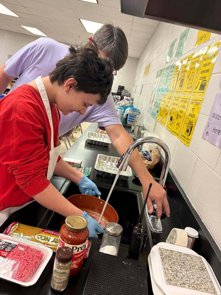 Principal Wilkerson sharing his favorite recipe with Courtesy Inc