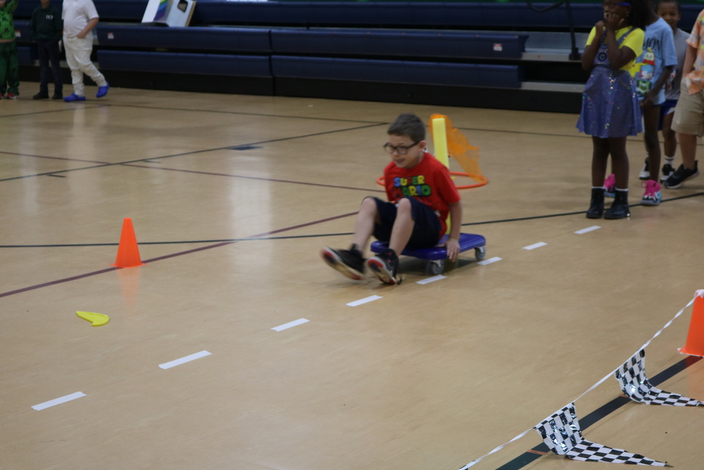 Student racing to the finish line in PE Class