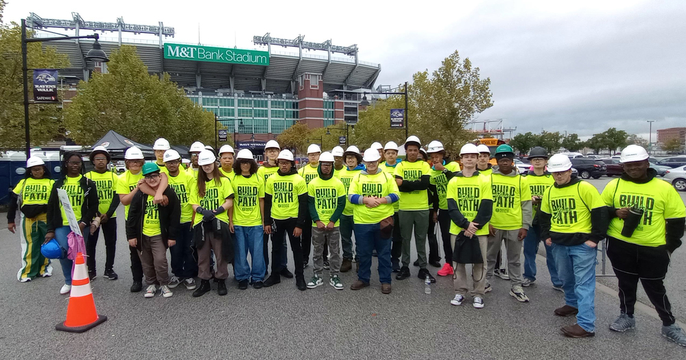 Students pose in front of M&T Bank Stadium