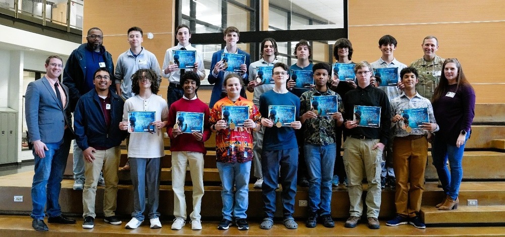 students posing with certificates