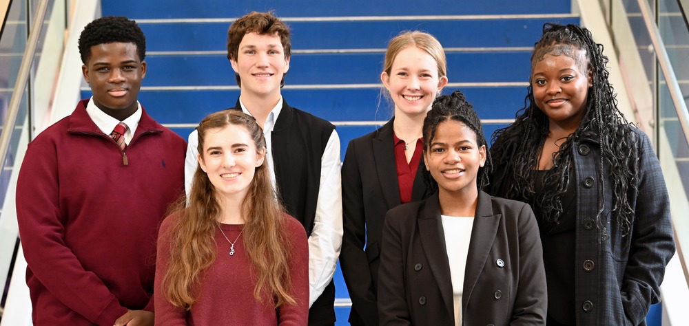 Photo of the six 2026 HCPS Pages standing on a staircase