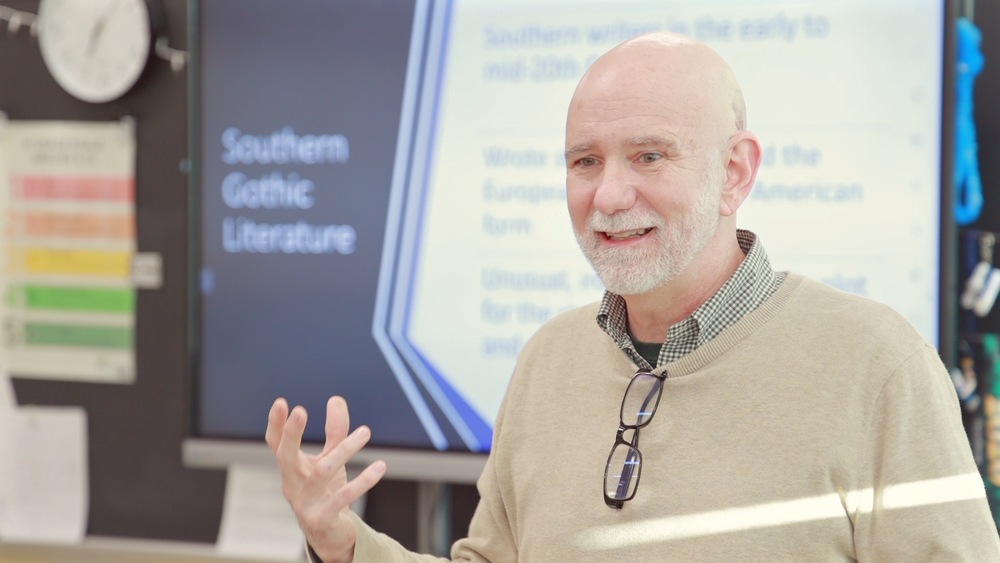 Mr. Michael James speaking to a classroom