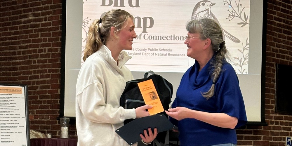 Student recieves award from Birding society.