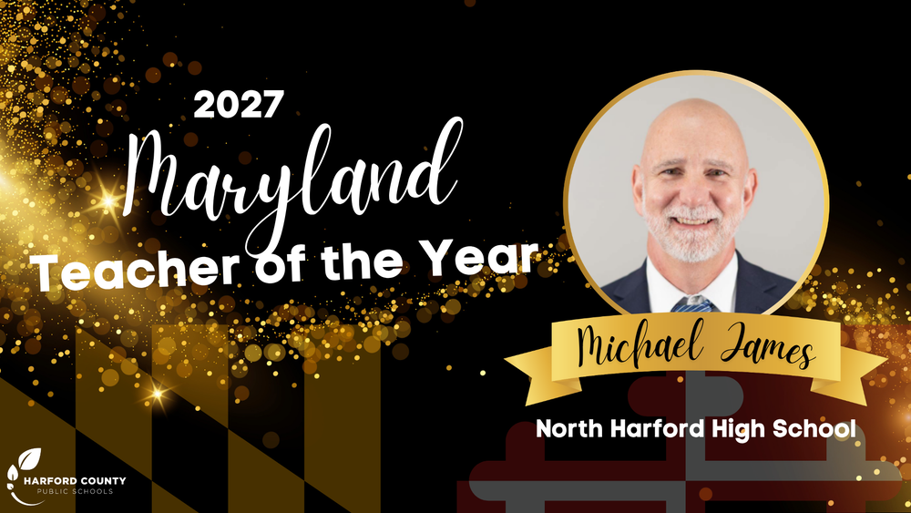 Graphic celebrating Michael James of North Harford High School as the 2027 Maryland Teacher of the Year. A gold-framed circular portrait shows him smiling, wearing a navy suit, white shirt and blue striped tie, with his name on a gold ribbon banner below. The black background features gold sparkles and Maryland flag design elements, with the Harford County Public Schools logo in the lower left corner.
