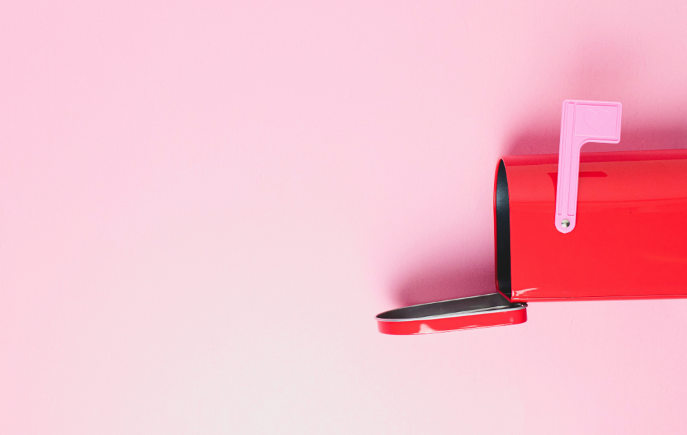 An open mailbox with the flag up.