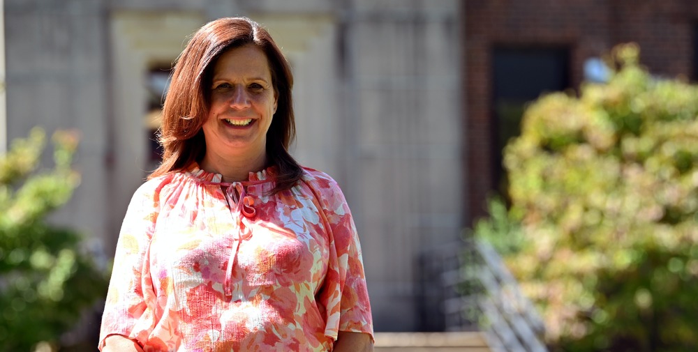 Mrs. Danielle O'Neill, principal of Darlington Elementary School standing in front of the building.