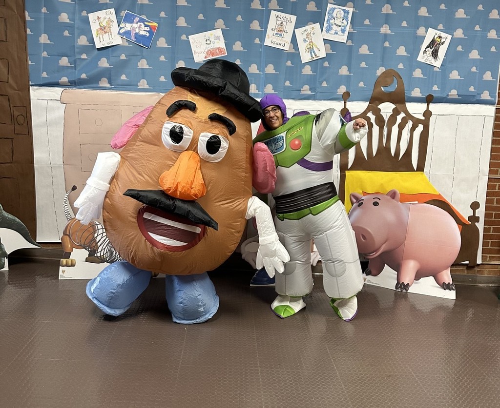 Picture of staff members dressed as Mr. Potato Head and Buzz Lightyear