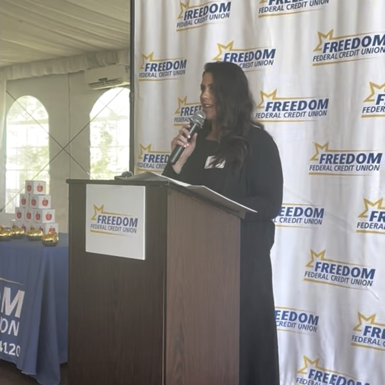 photo of Mrs. Coyne providing the acceptance speech on behalf of Mrs. Gilmour
