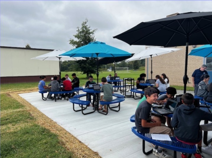 BAMS Outdoor Classroom with students from Ms. Klein's math class enjoying this new environment.
