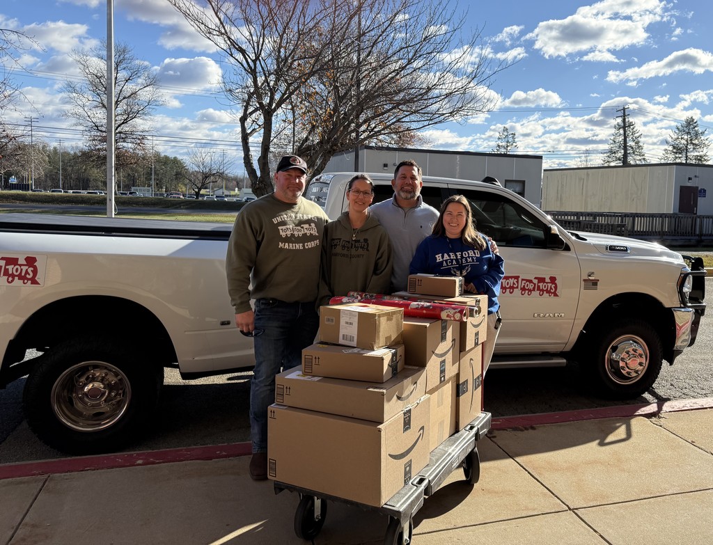 photo with toys for tots donation