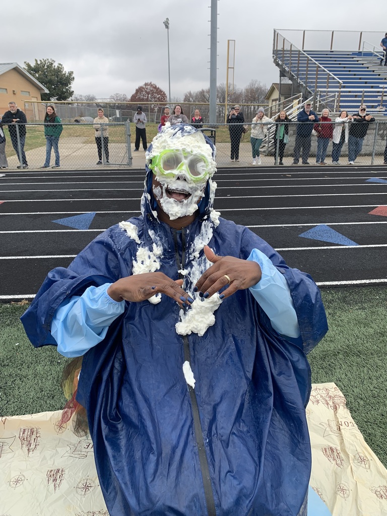 Mrs. Sample was prepared with goggles and a poncho, but that was no match for Ellen Radion's pieing!