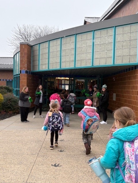 Students excited to enter the building through our tunnel of cheering adults!