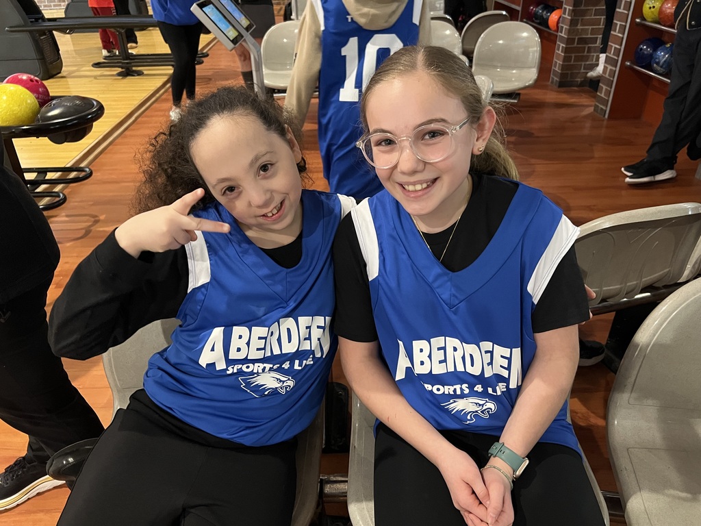 Students are wearing  blue Aberdeen Middle Sports for Life Jerseys at the bowling alley.