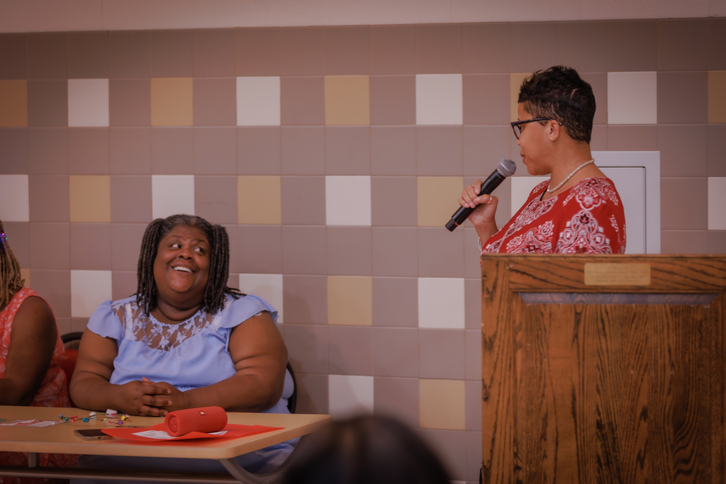 Interim Superintendent Dr. Dyann Mack speaking with Chiwy Webster of Edgwood High School