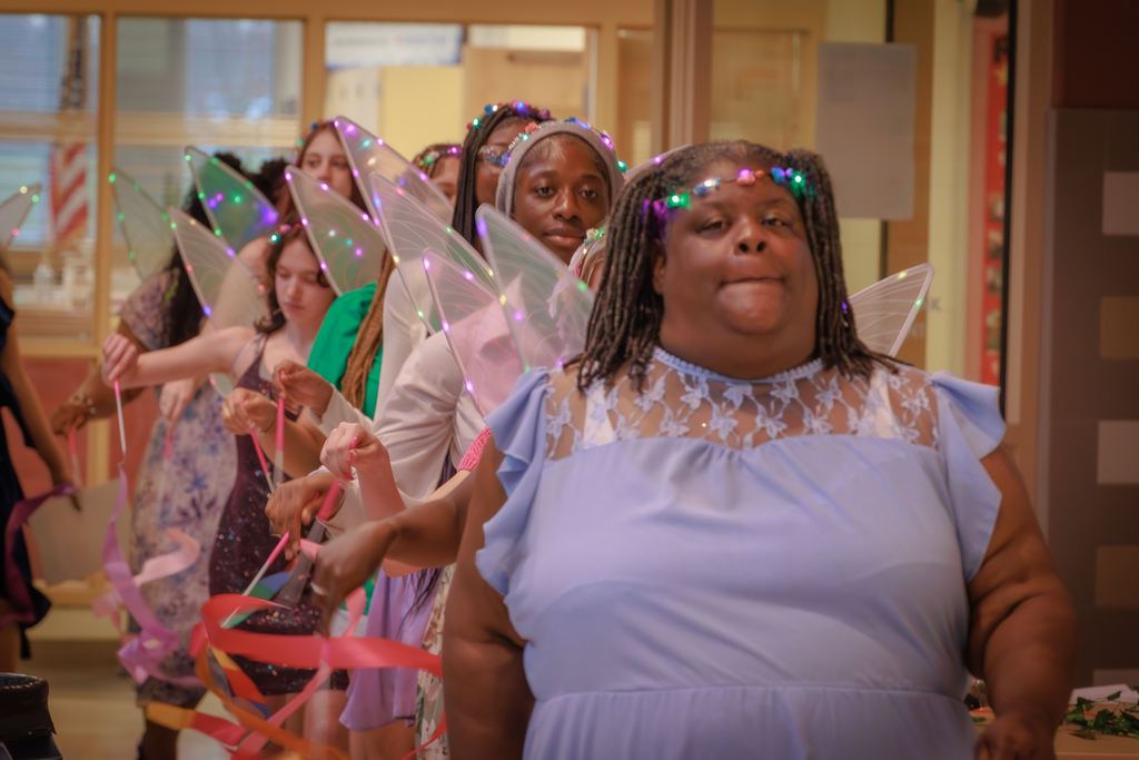Group of women walking into a cafeteria