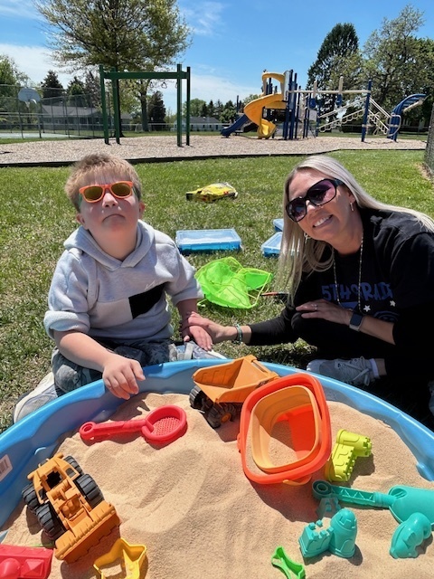 Teacher and student at sand box