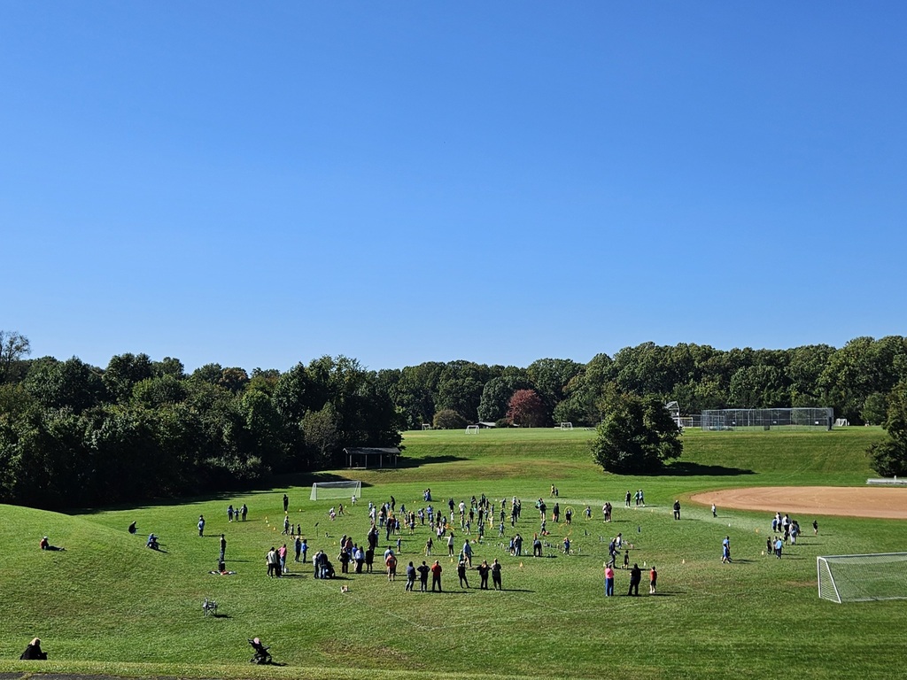 families in the field running laps